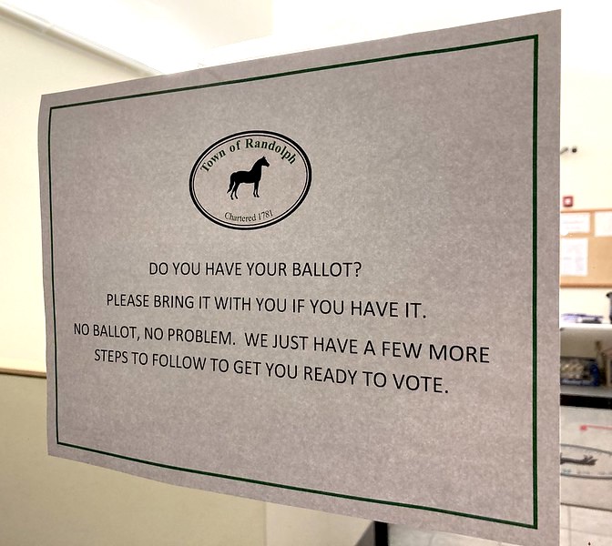 a sign in the door that says to bring your ballot if you have one.