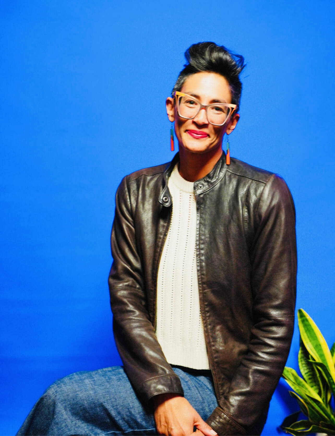 wonam in leather jacket w blue background