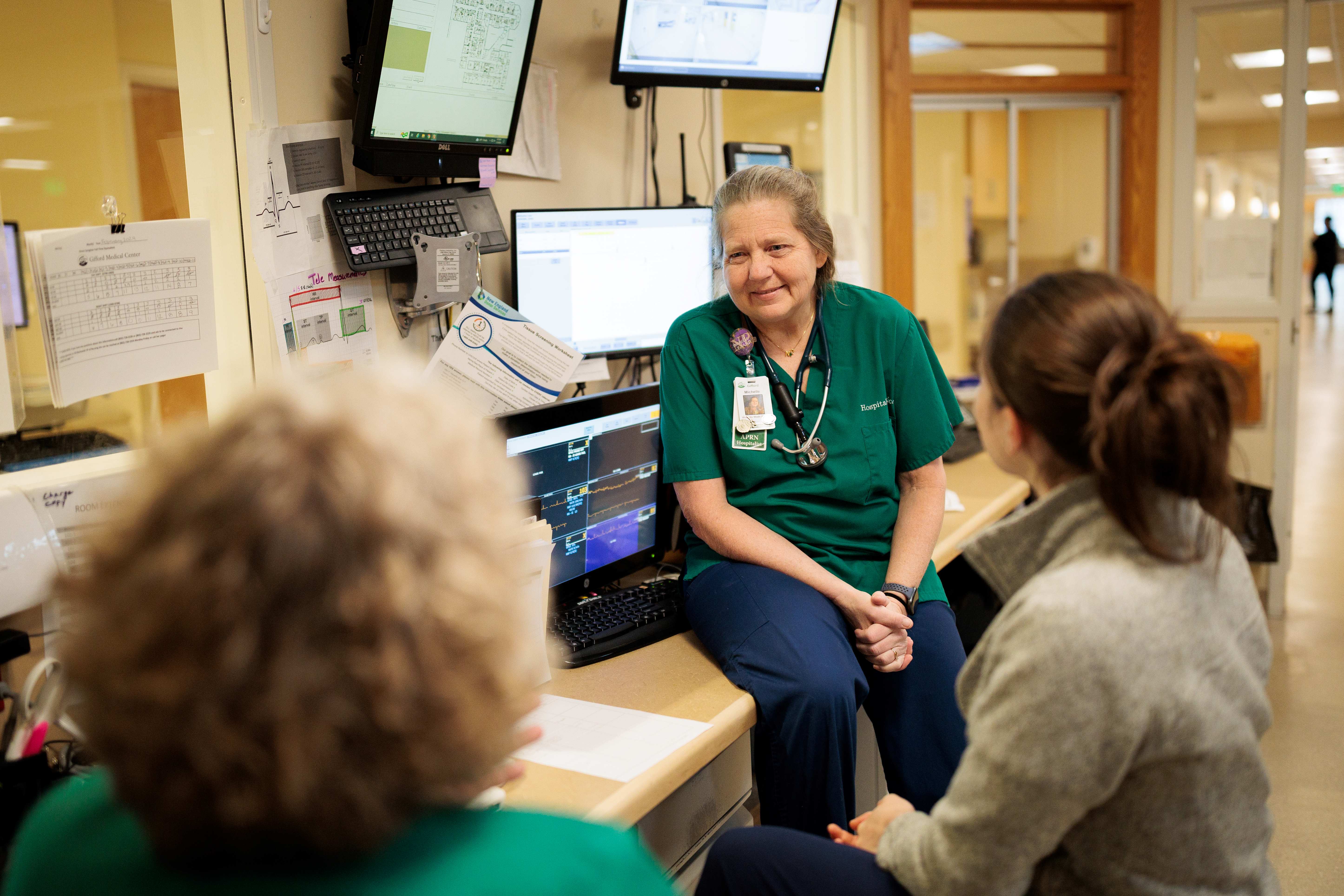 Nurses sitting in a hospital talking