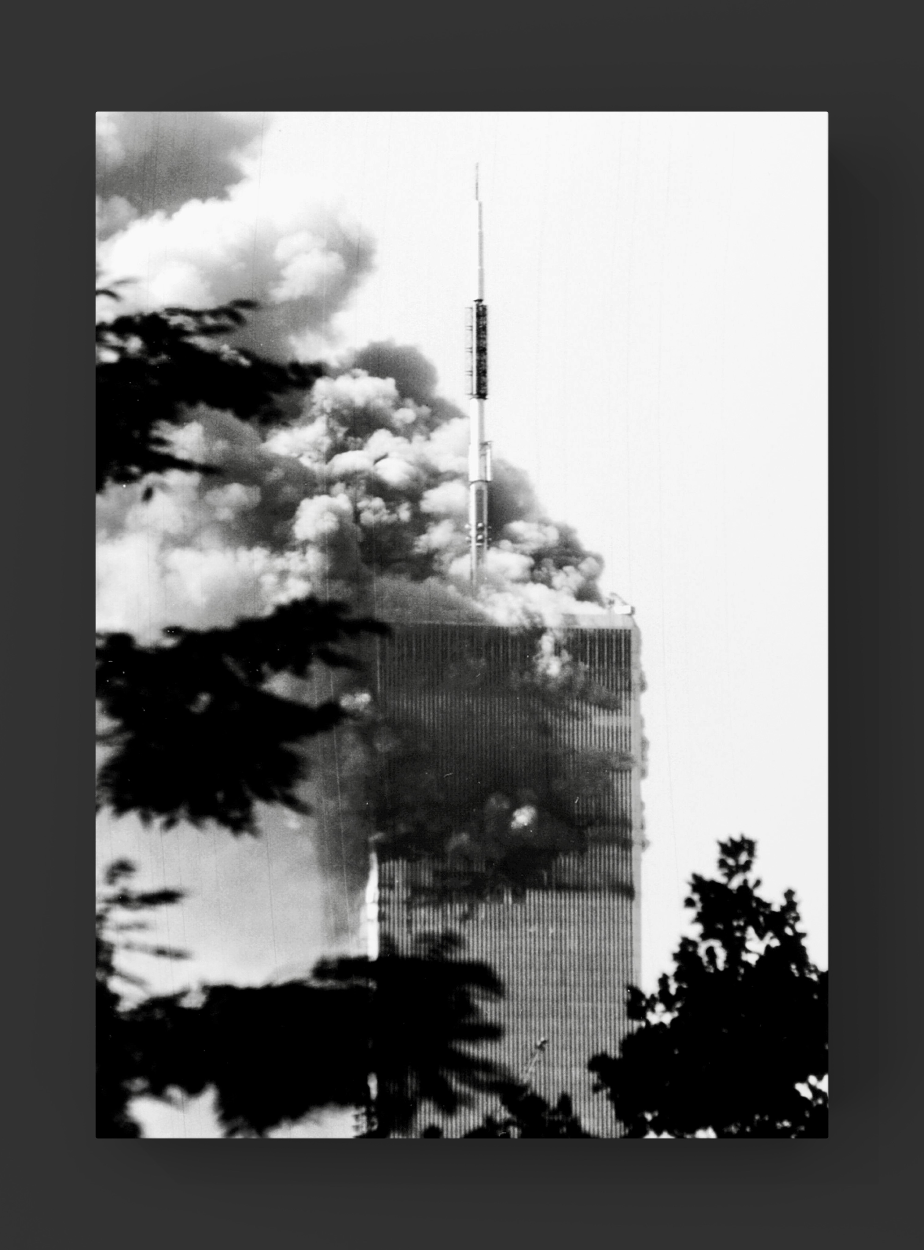 The World Trade Center burning, smoke filling the air