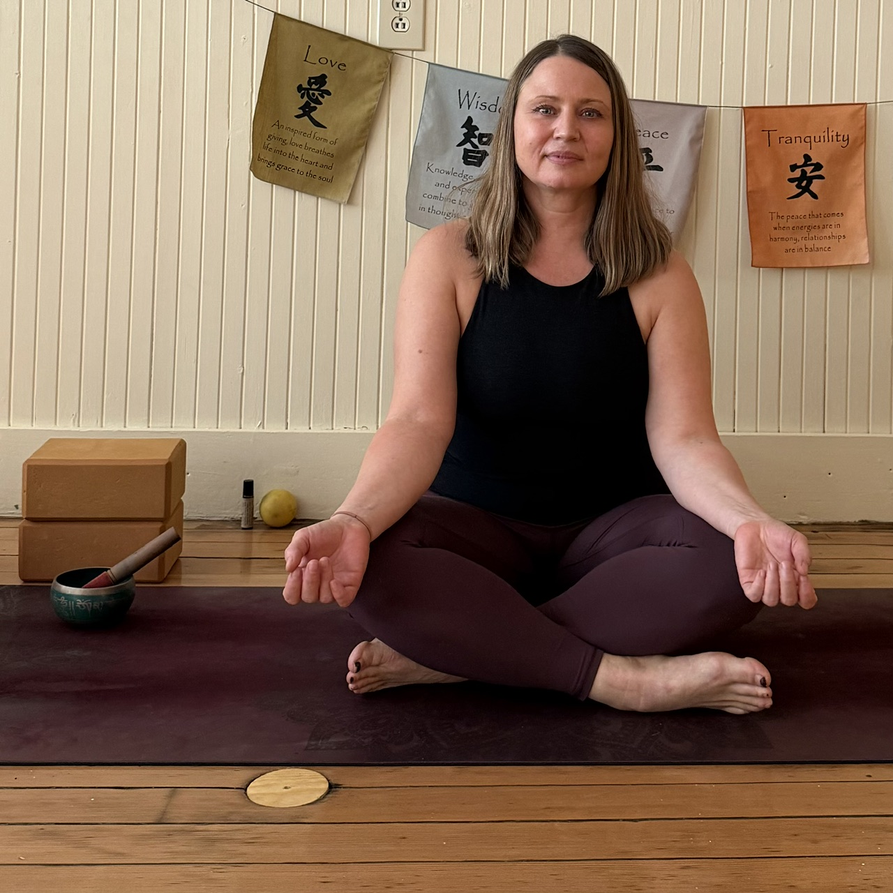 Emily doing yoga in the studio