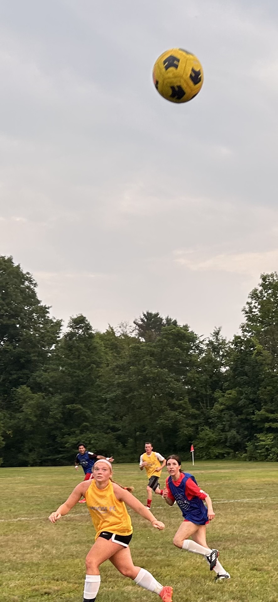 two women playing soccer