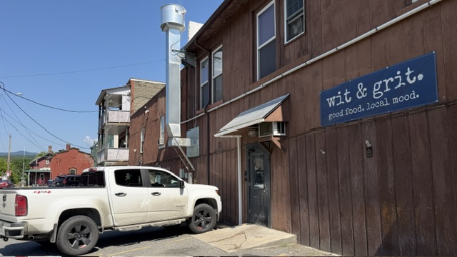 back entrance of W&G w white truch parked next to their sign