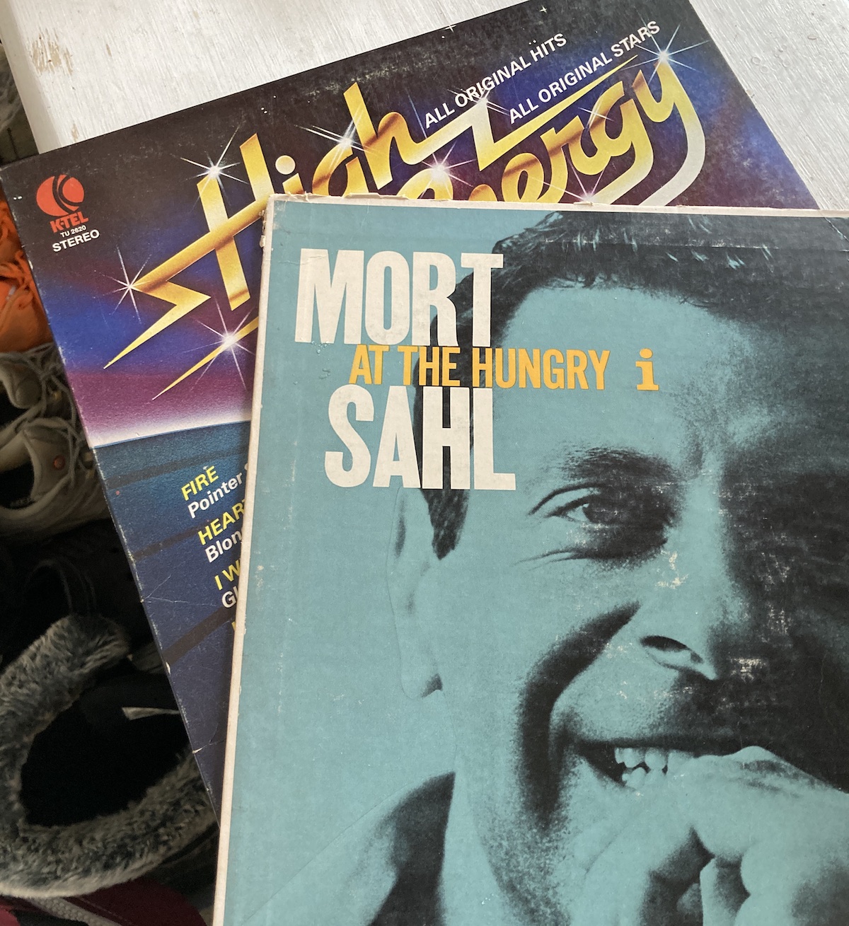 two record albums, a k-tel special from the 1980s and one from Mort Sahl from the 1960s