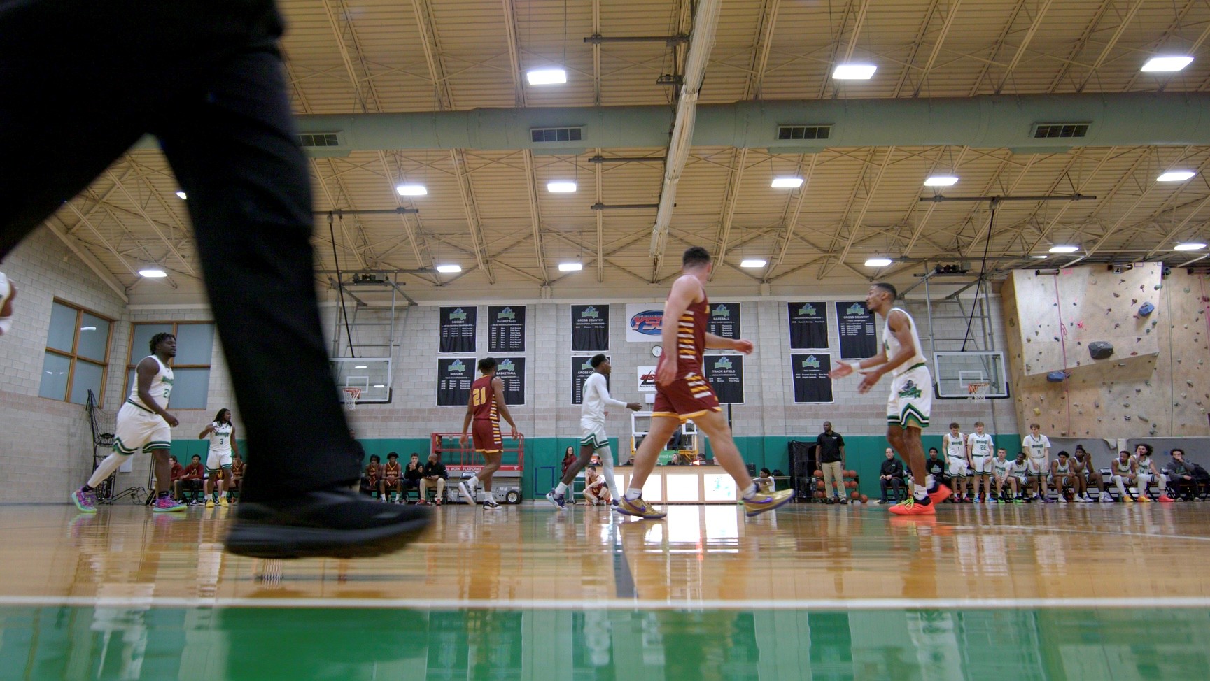 basketball court, well lit, with players playing