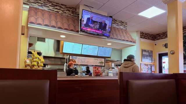 pizza shop counter and tv