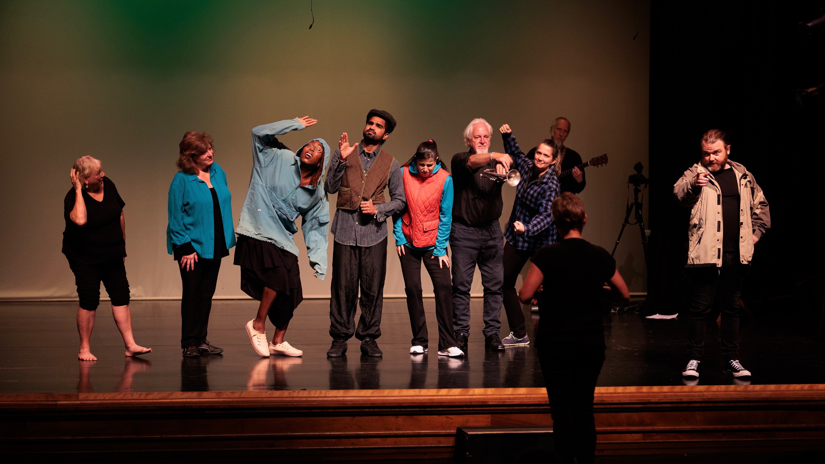 10 performers on a stage