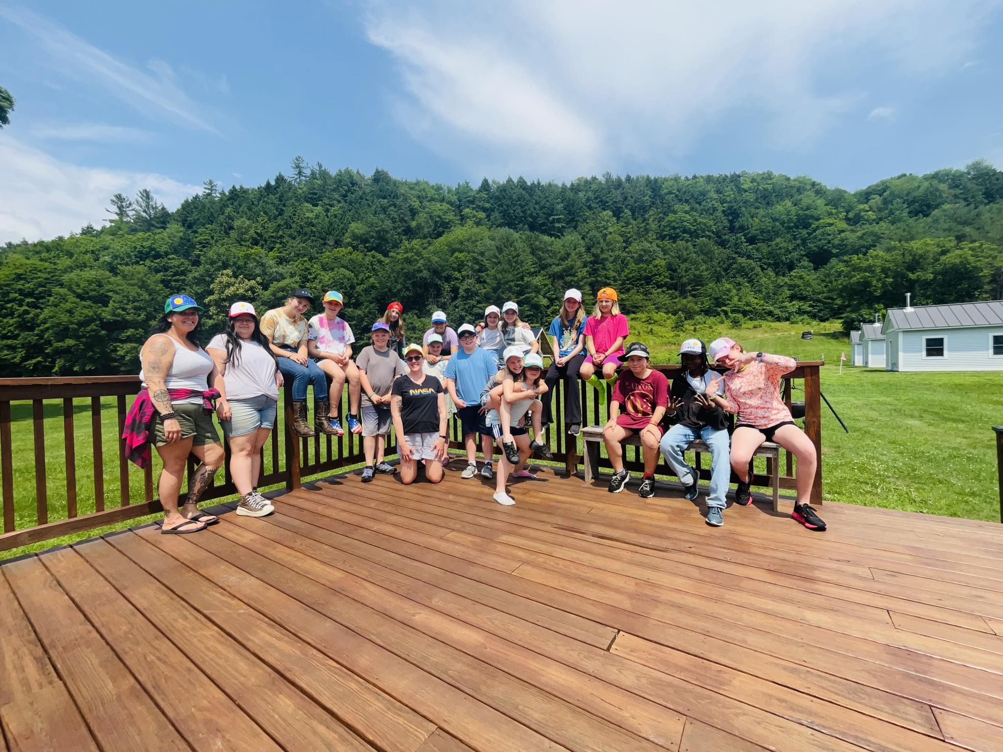 a dozen people from a summer camp outside