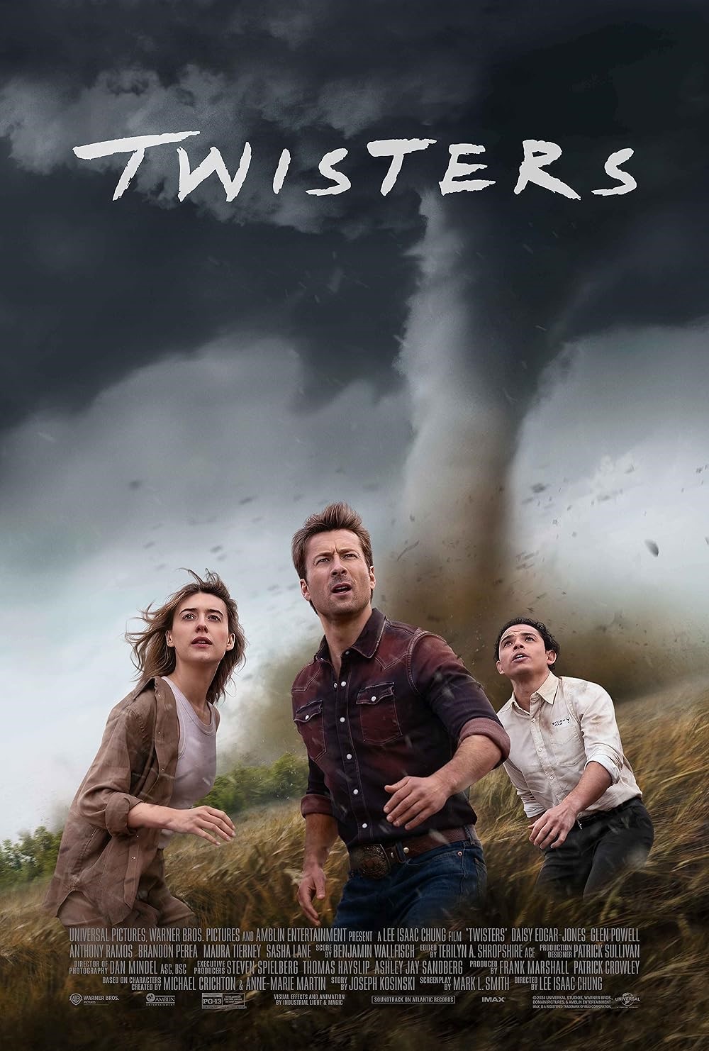 three people running from a twister