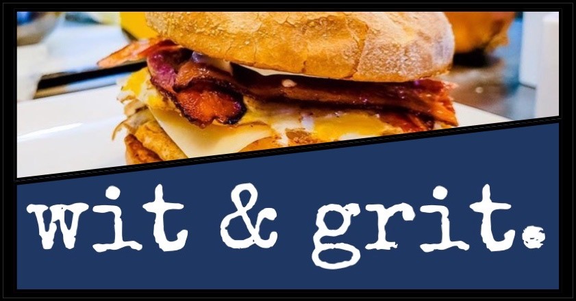 W&G breakfast sandwich w bacon and their blue logo with white lettering