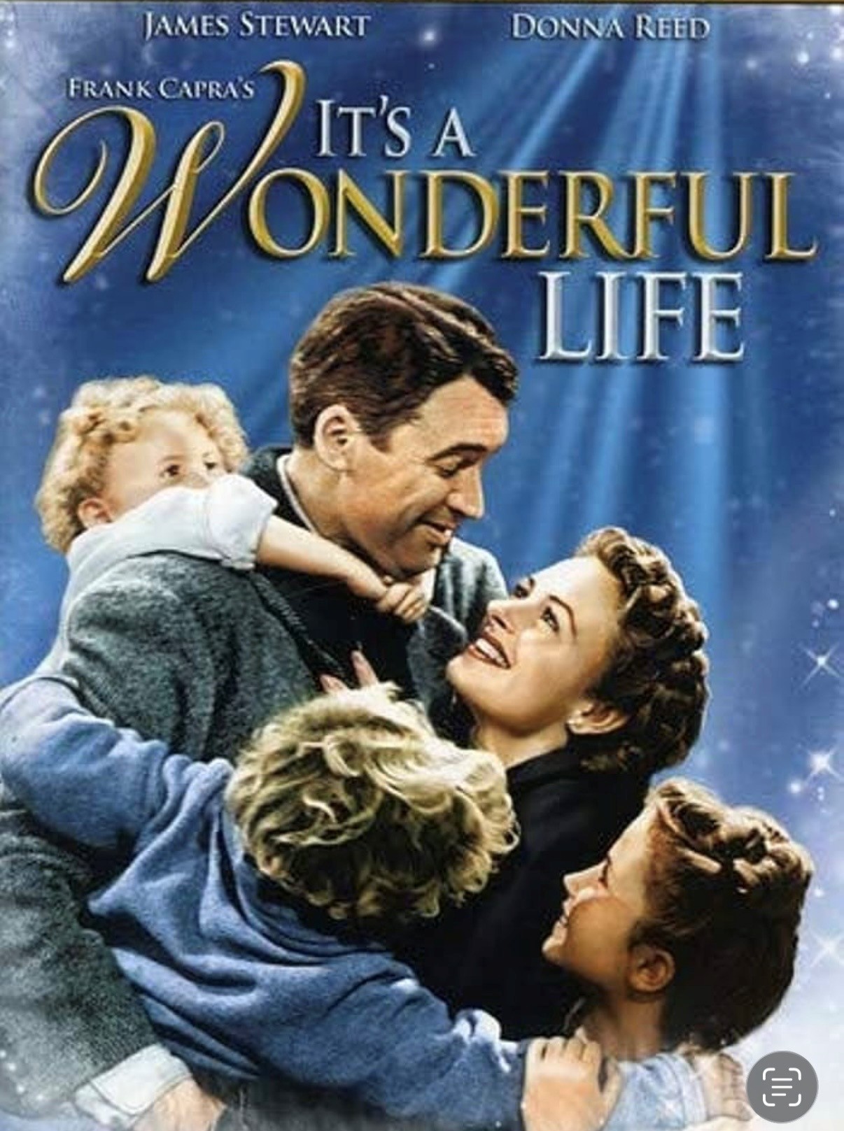 couple embracing with three children