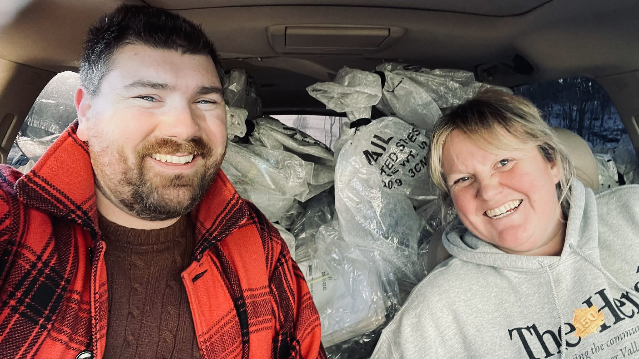 Tim and Katie delivering the week's papers